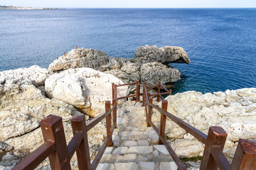 Stairs to cave in Cape Greco national forest park. Cyprus