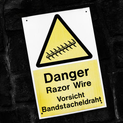 Razor wire warning sign