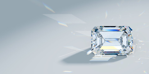 Close-up emerald cut diamond with caustics rays on light blue background