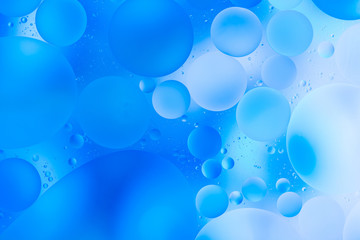 water drops on glass with blue background, close-up 
