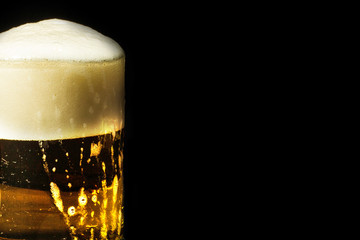 mug of beer on dark background