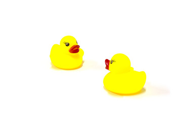A row of yellow toy on white background and one of the ducks facing in a different direction, Undisciplined, Think outside the box concept, isolated.