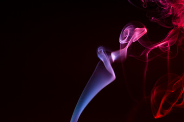 Colorful smoke close-up on a black background