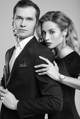 Sensual beautiful young couple dressed in formal clothes