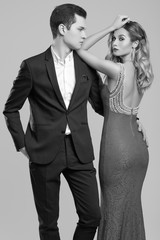 Sensual beautiful young couple dressed in formal clothes