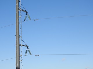 Electricity pylon, electric transmission tower, against the blue sky. Energy tower.