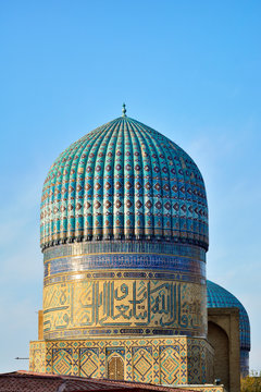 Dome of Bibi Khanum Mosque against cloudy sky