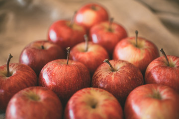 Close up view of red apples as background. Heap of ripe red apples. 