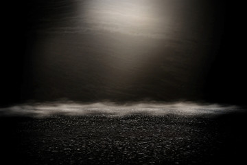 Fototapeta premium Spotlight over concrete floor. dark black background