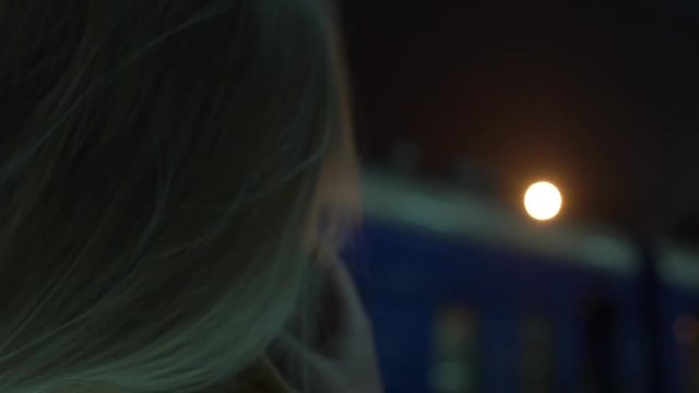 Slow Motion Woman With Cigarette At Railway Station