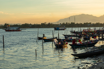 Traditional boats in Hoi An, Vietnam. Sunset time. Hoi An is the World's Cultural heritage site, famous for mixed cultures & architecture.