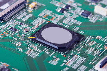 Electronic circuit board close up.