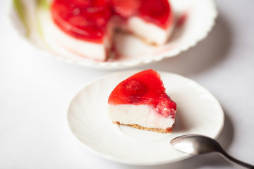 Homemade strawberry cake on white background 