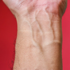 Man with clenched fist and veins popping out