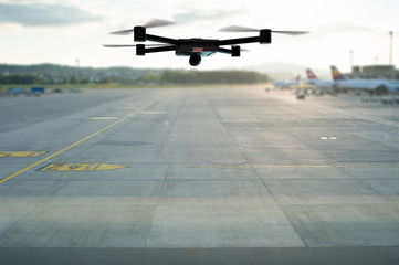 drone flying above the airport runway
