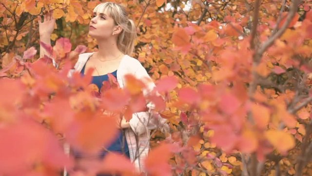 Slow Motion Portrait Of A Young Beautiful Woman Enjoying Autumn In The Park