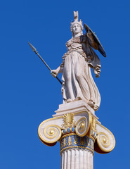Athena statue the ancient greek goddess of science and wisdom, on crystal clear blue sky background