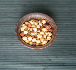 Healthy food  for background image close up hazelnuts.  Nuts texture on top view on the cup plate