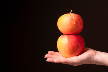 red apple on girl's hand
