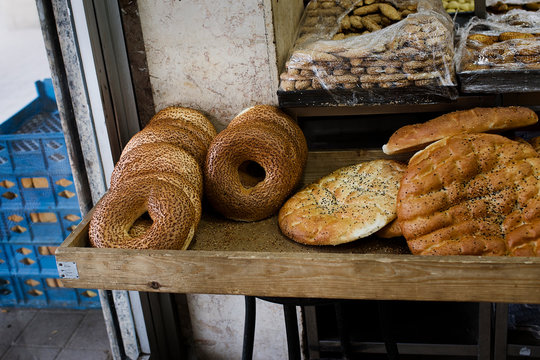 Traditional Turkish Simit and Flatbreads Displayed at a Local Bakery