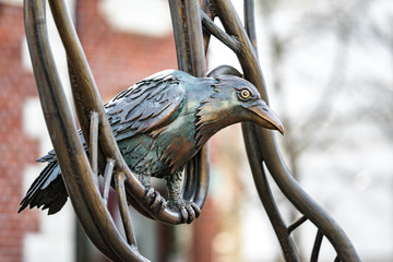 Bronze monument with a crow