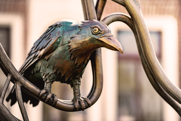Bronze monument with a crow