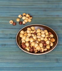 Healthy food  for background image close up hazelnuts.  Nuts texture on top view on the cup plate