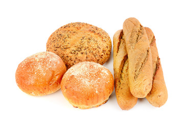 Appetizing grain bread, baguette and buns isolated on white background.