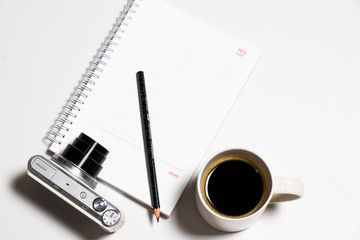 Top view coffee and camera notebook on Flat lay