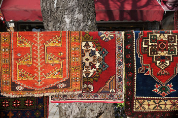Traditional Turkish carpets hanging on street. Istanbul, Turkey.