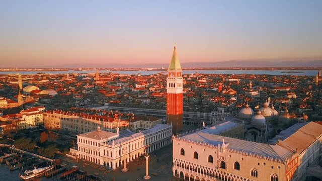 venice aerial view drone at sunrise fly around orbit over st mark square cut three italy