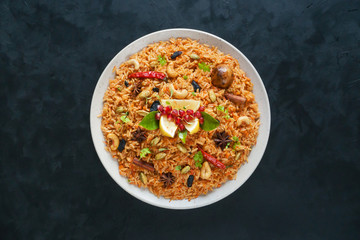 Ramadan food. Vegetarian Kabsa with rice and nuts.