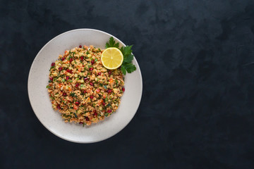 Ramadan food. Salad with couscous and pomegranate.