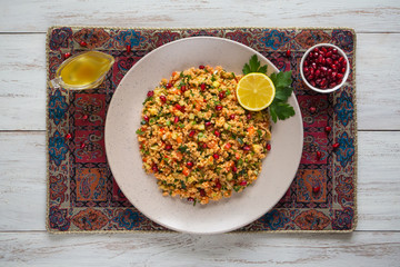 Ramadan food. Salad with couscous and pomegranate.