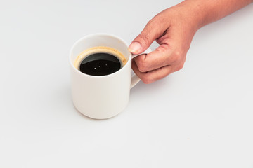 girl's hands holding coffee cup with plant flat lay top view