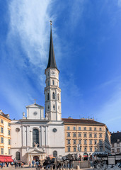 Fototapeta na wymiar Michaelerplatz with Church St. Michael in Vienna