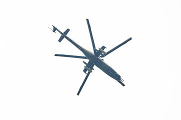 Helicopter flying in the blue sky