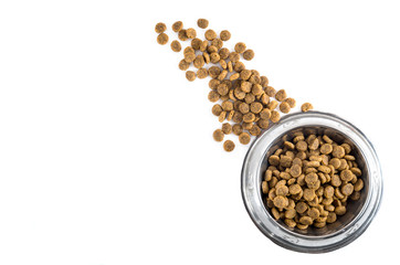 dry pet - dog food in metal bowl on white background top view
