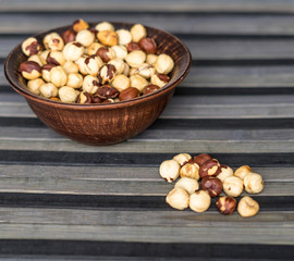 Healthy food  for background image close up hazelnuts.  Nuts texture on top view on the cup plate