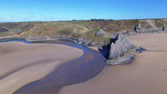 Aerial view of Three Cliffs Bay south coast beach the Gower Peninsula Swansea Wales uk