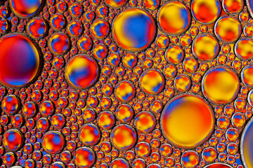 Abstract textured background of colorful oil and water bubbles