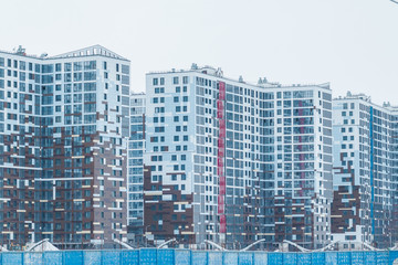 Construction of a new house. Construction in the modern quarter. New high-rise building. new multi-storey residential buildings. The construction of a new housing estate. The exterior fragment