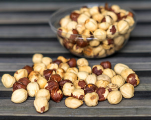 Healthy food  for background image close up hazelnuts.  Nuts texture on top view on the cup plate