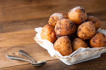 Small homemade donuts close-up on the table. Sweet dessert. cheese round donuts. Copy space.