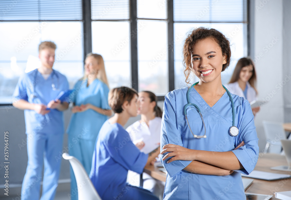 Canvas Prints Smart medical student with her classmates in college