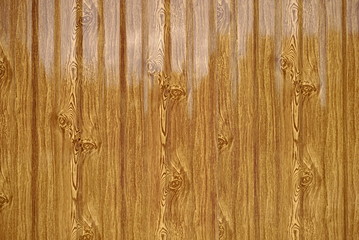 The Metal Profile. Metal profile background under the texture of wooden boards