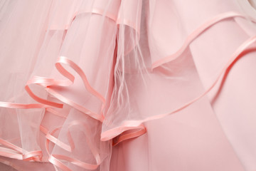 Wedding dress detail. Pink wedding dress frills close up.
