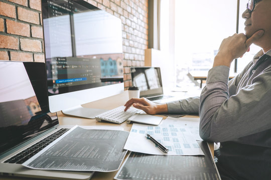 Professional Developer programmer working a software website design and coding technology, writing codes and database in company office, Global cyber connection technology