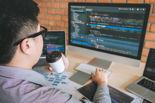 Professional Developer programmer working a software website design and coding technology, writing codes and database in company office, Global cyber connection technology