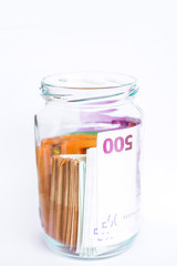 Pile of Euro banknotes isolated on a white background